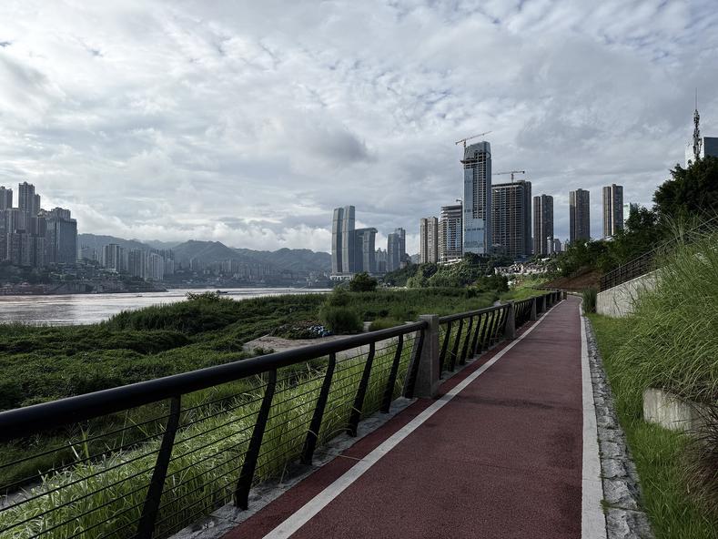 An early morning sweaty run along the Jiangbeizui Riverbank Park in Chongqing, China on July 24, 2025. A comparable environment would be if Miami had a heat wave in the dead of summer and then got sucked into hell.