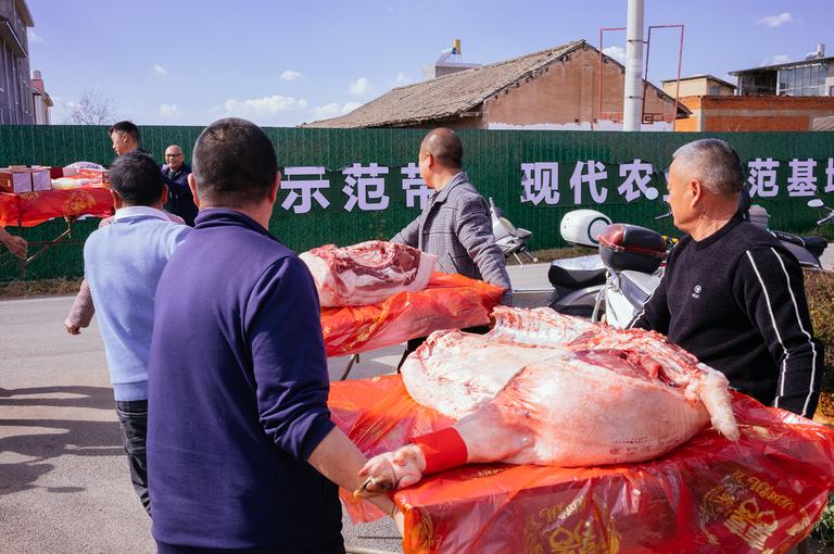 A better view of the butchered pig as we left the pavilion. It took three tables and a few baskets to carry all of the dowry items.