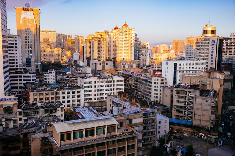 A sunrise view from our hotel room in Kunming, China. The fair weather was such a relief after being in Beijing.