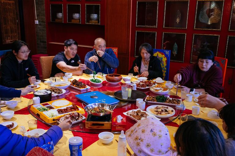 The widespread adoption of Lazy Susans for all large dining tables is simply brilliant on the part of Chinese culture. Faces have been pixelated for privacy.