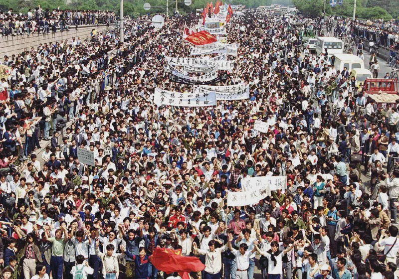 Thousands of students from local colleges and universities march to Tiananmen Square, Beijing, on May 4, 1989, to demonstrate for government reform. AP Photo/Mikami