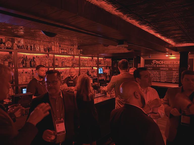 Late in the evening at a vendor sponsored event at a prohibition themed bar.