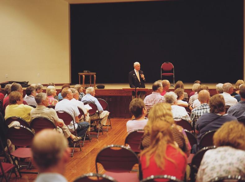 Senator Orrin Hatch (R-UT) held a town hall meeting at Farmington City Hall. Much of the meeting was fielding comments and questions by local citizens. The line to speak at the microphone (camera right) stretched to the back of the crowd throughout most of the meeting.