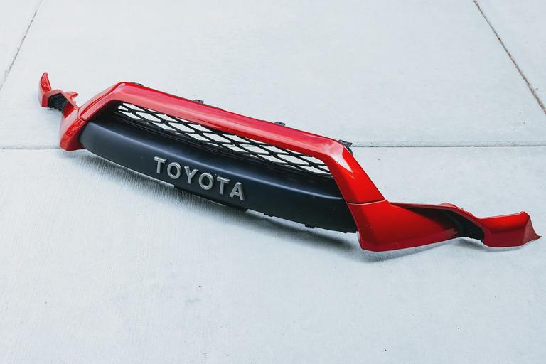 Plastic bumper after trimming. Plastic bumper after trimming.