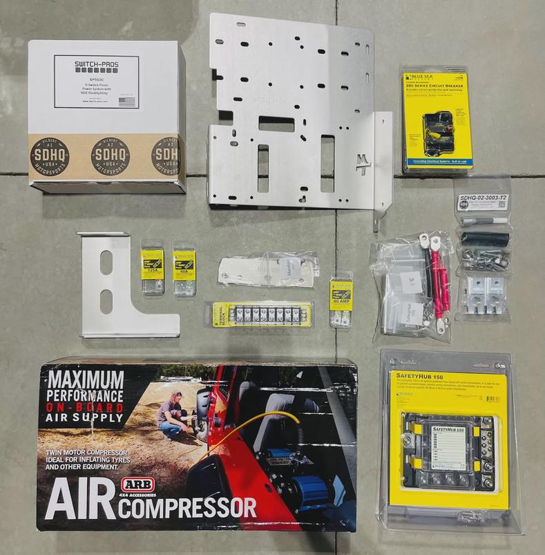 The Switch Pros SP-9100, SD Offroad Mount Tray, and ARB Twin Compressor ready for assembly.