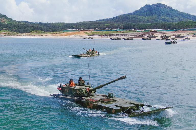 Amphibious armored infantry fighting vehicles (IFV) of an army brigade under the PLA Eastern Theater Command form battle formations in waves during a maritime combat training exercise on June 30, 2022. Source: eng.chinamil.com.cn/Photo by Peng Zhifu.